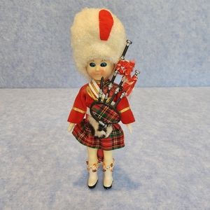 Scottish Bagpiper vintage souvenir costume doll moving eyes 6 1/2" hard plastic.